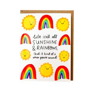 photo of illustrated greeting card with smiling suns and rainbows